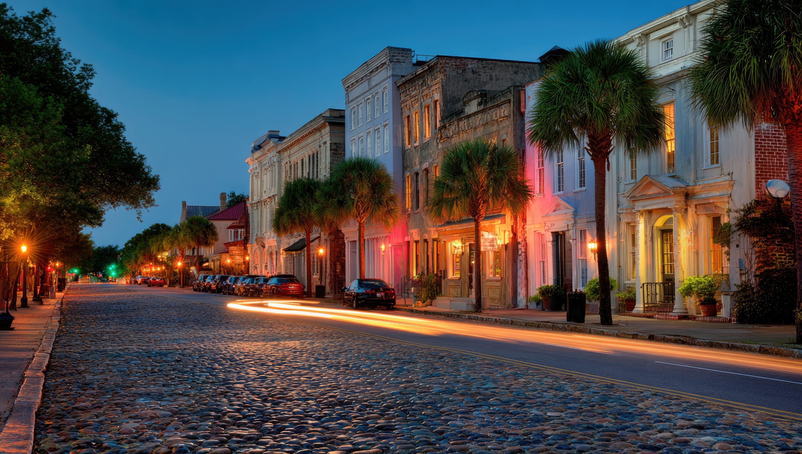 Cobblestone street at twilight, historic buildings, palm trees (1)